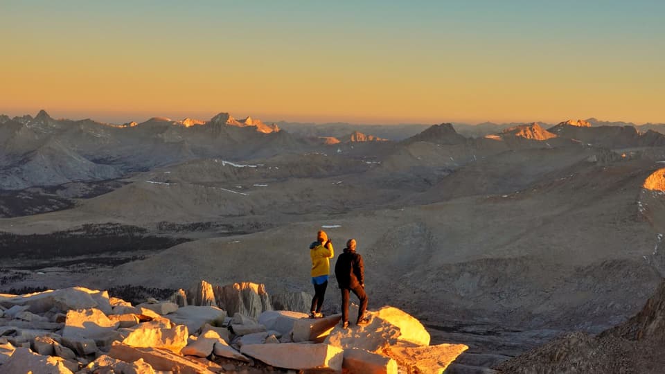 Figures on the Whitney summit rocks in first light