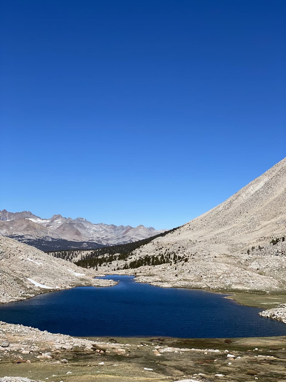 Deep blue Guitar Lake under the west face of Whitney