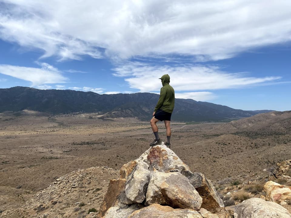 Atlas standing on a rock pinnacle above the San Felipe Hills