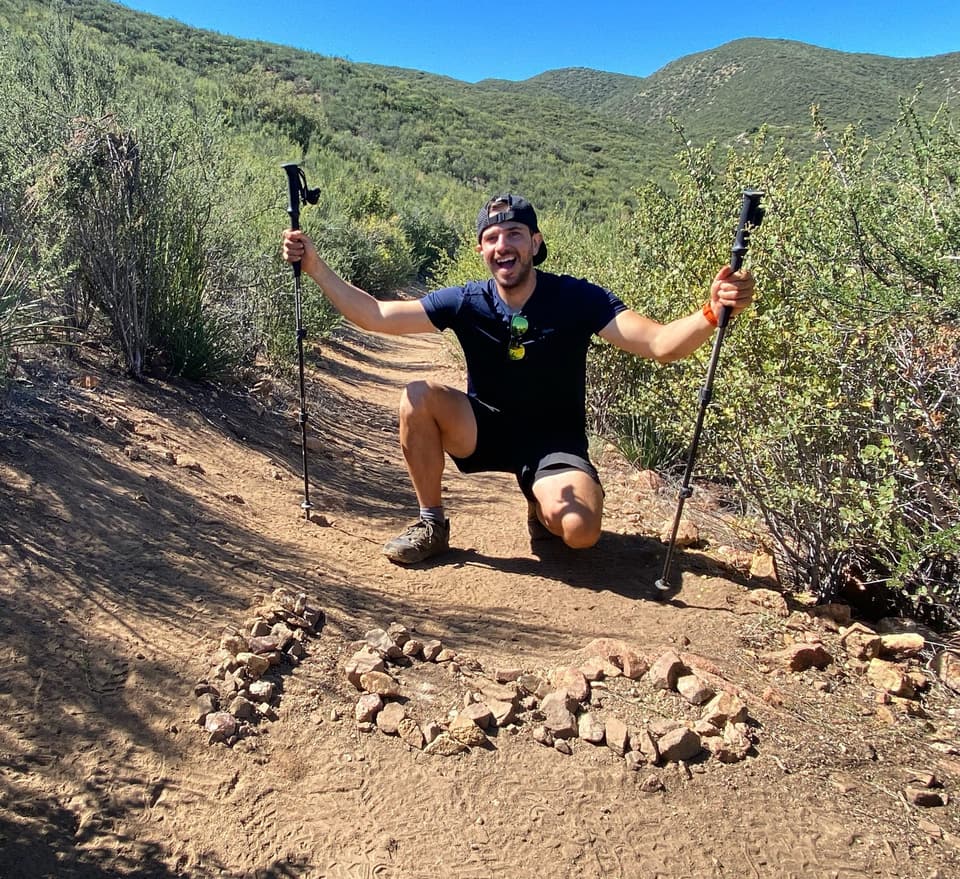 the 100 laid out in rocks, trekking poles in the air