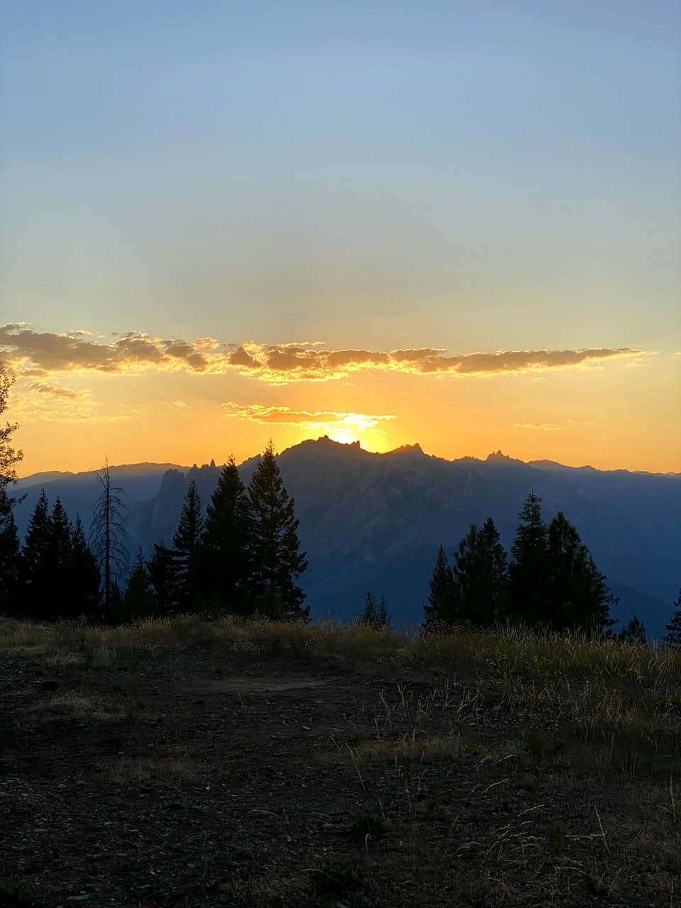 the sun going down over far ridges from the ridge camp on day 84