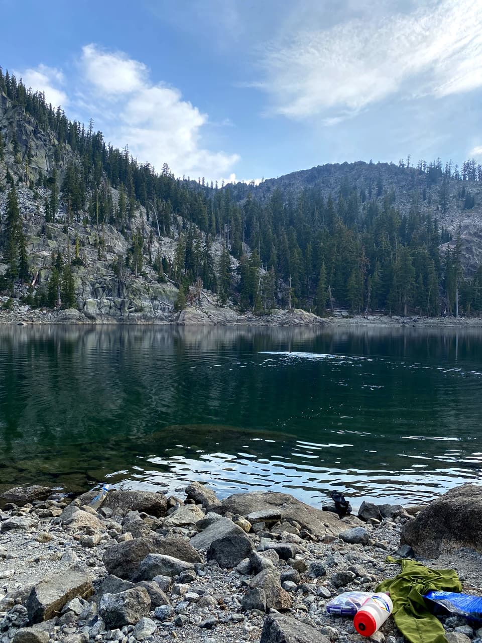 a clear green alpine lake set in granite