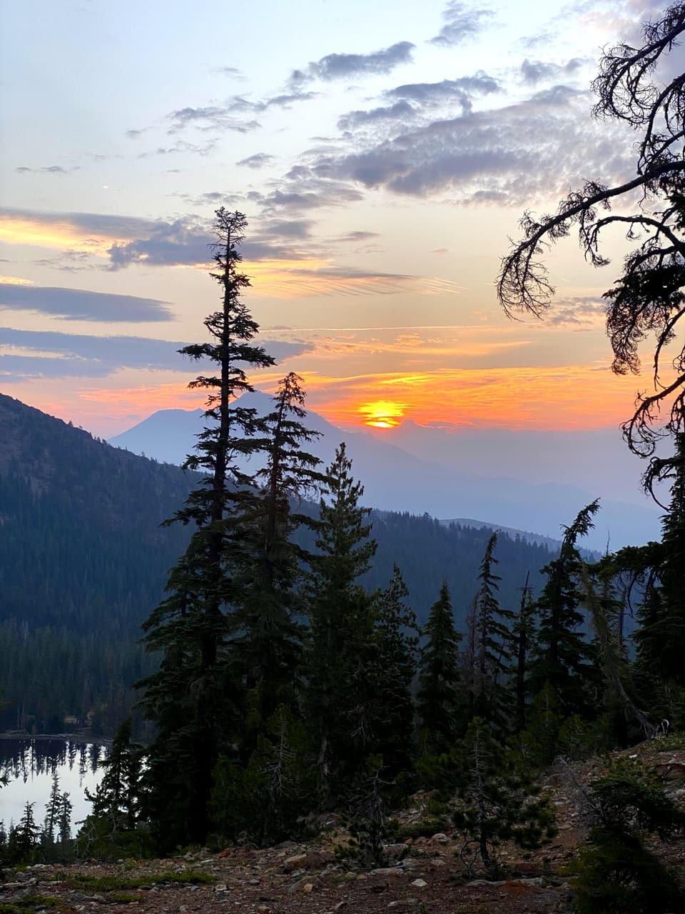 a smoky sunrise over a lake basin