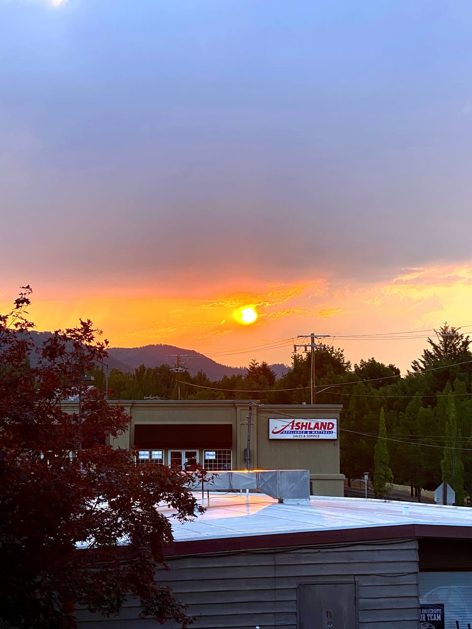 a smoky sunset over town, day 94