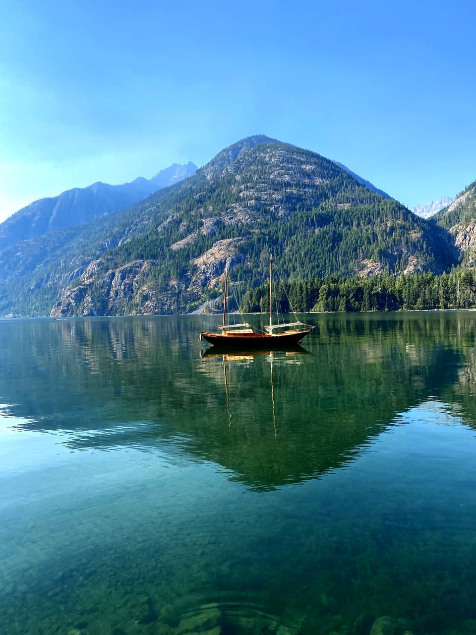 a sailboat on calm Lake Chelan