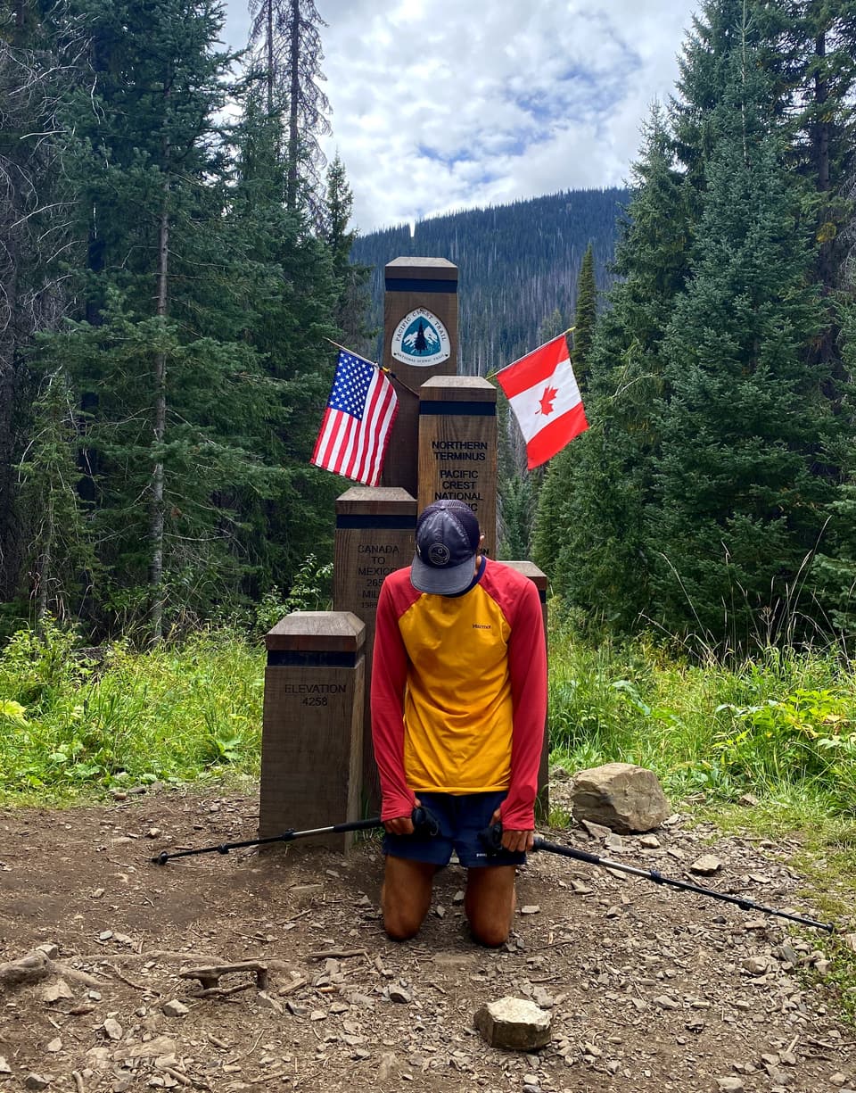 Atlas kneeling with his head bowed at the northern terminus