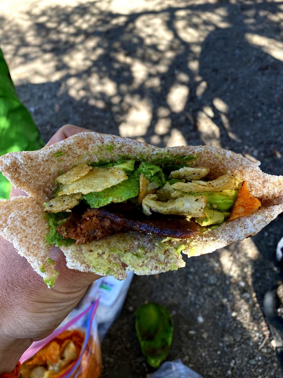pita filled with avocado, BBQ chips and vegan jerky
