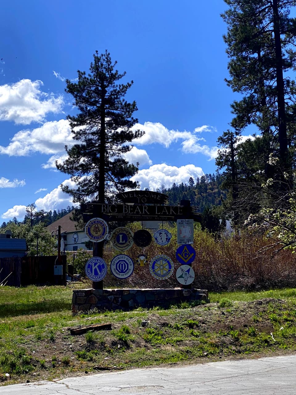 Big Bear welcome sign with club emblems