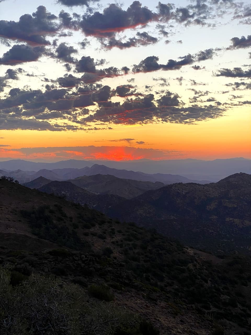 sunrise above layered desert ridges on the Kennedy Meadows push