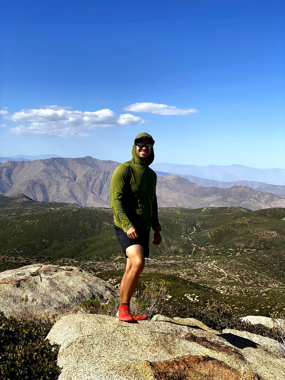 Atlas standing on granite above the desert